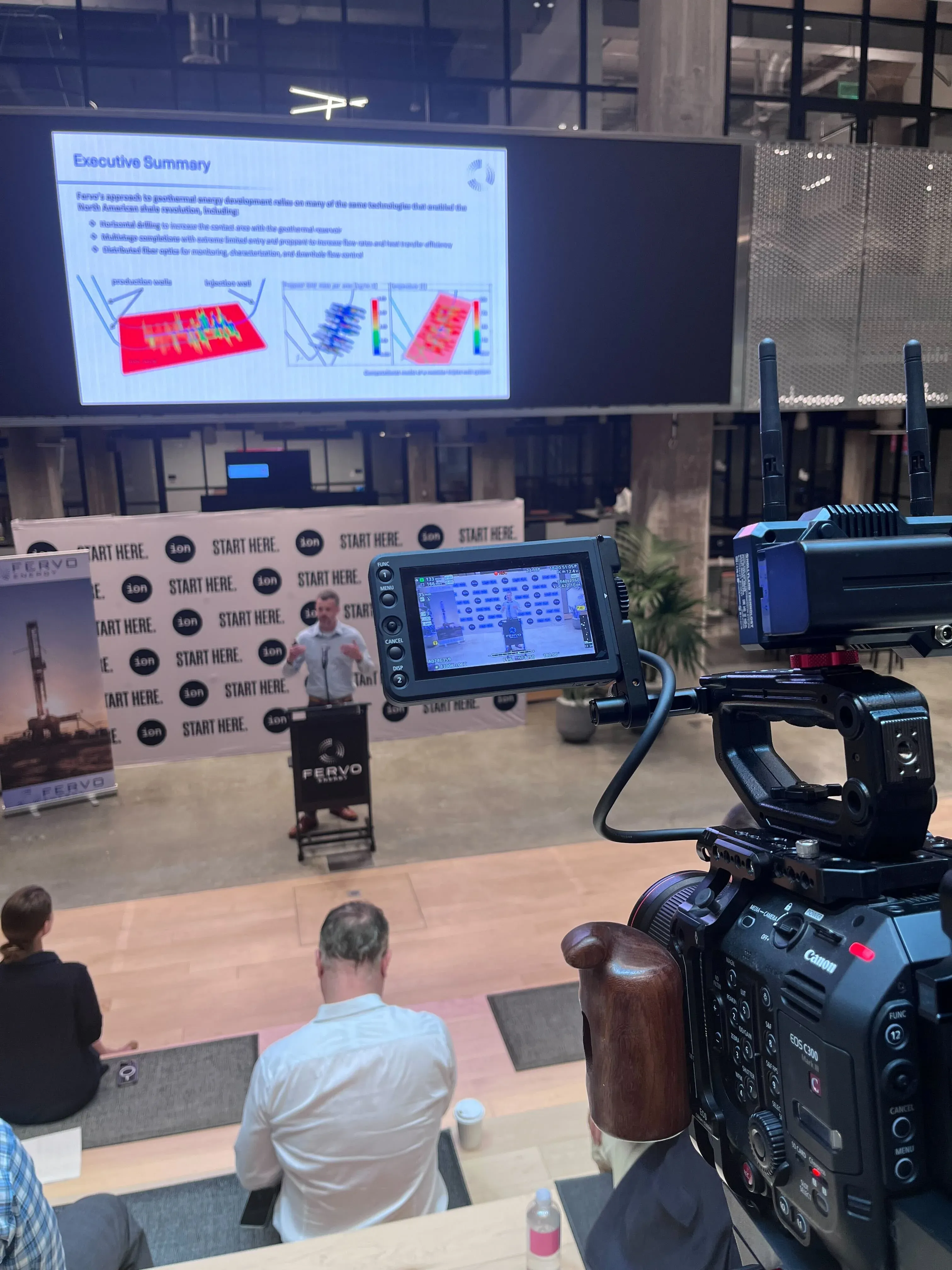 Canon C300 cinema rig capturing a Fervo Energy executive presentation at the ION Houston event by Motion Giraffx.