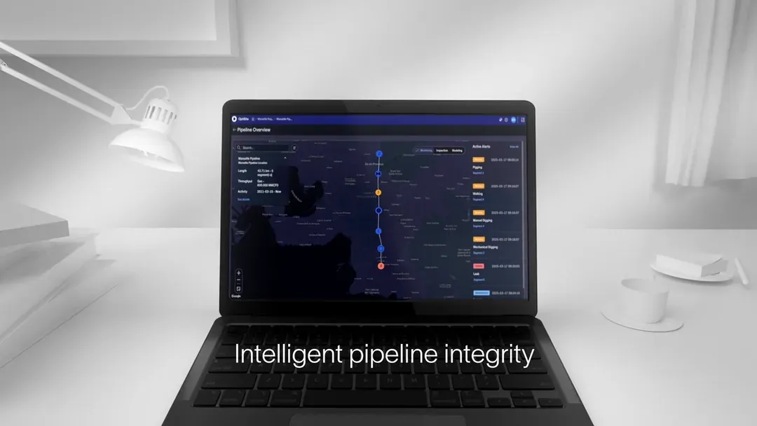 Laptop screen displaying pipeline integrity dashboard with map overview and real-time leak alerts.