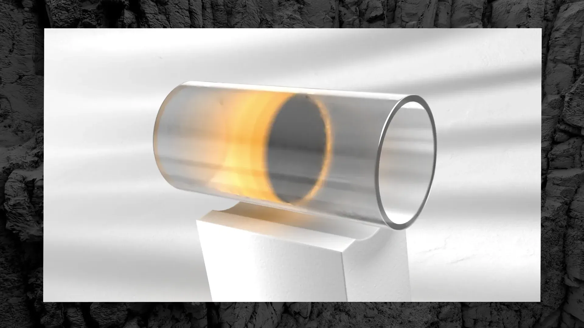 Clear glass cylinder on a white pedestal with an orange glow inside it, set in a white frame over a black rock texture, from the SLB Deka 3D animation by Motion Giraffx