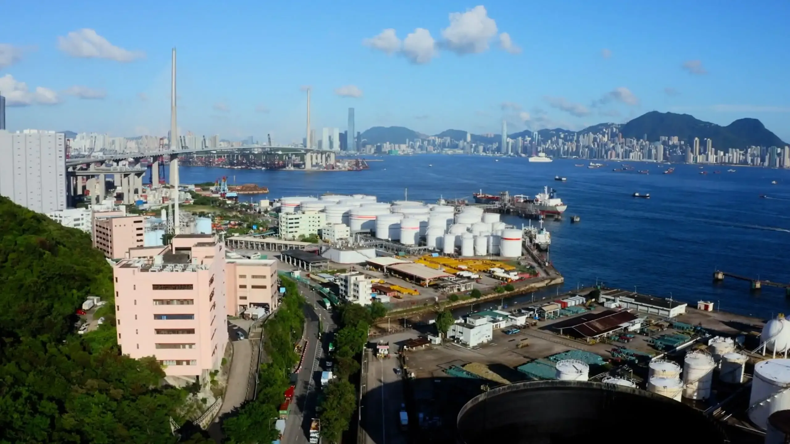 Aerial shot from the SWN video showing a refinary near a city.