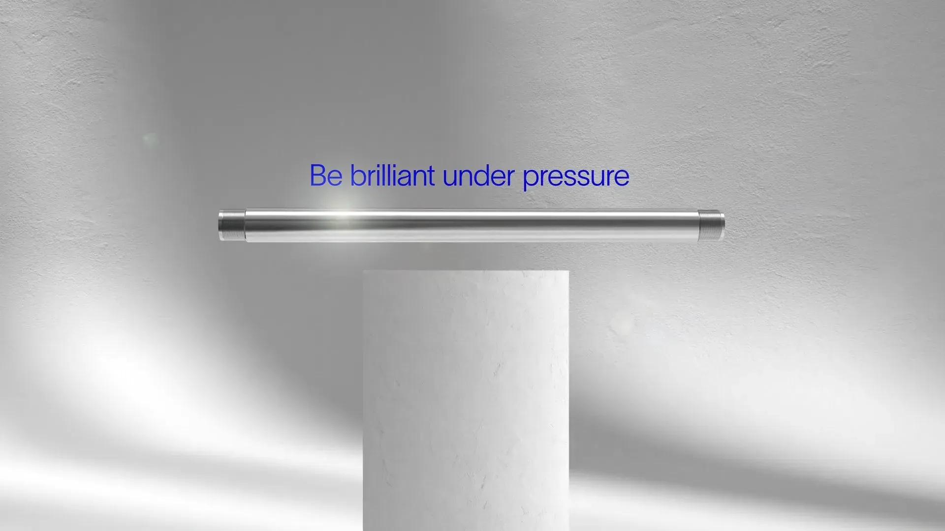 Pipe floating above a white pedestal under the on-screen tagline "Be brilliant under pressure," from the SLB Deka 3D animation by Motion Giraffx