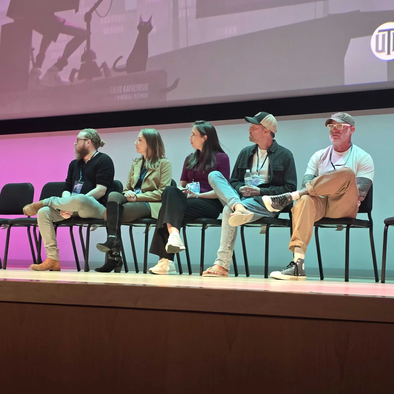 Five people seated on a stage at Industry Giants 2026, with Cara Lackey in a tan blazer second from left