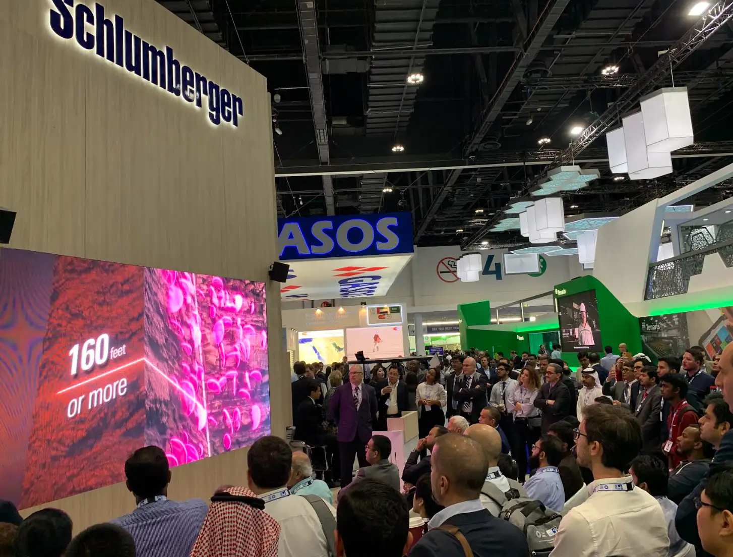 Trade show booth with animated video display capturing attendee attention