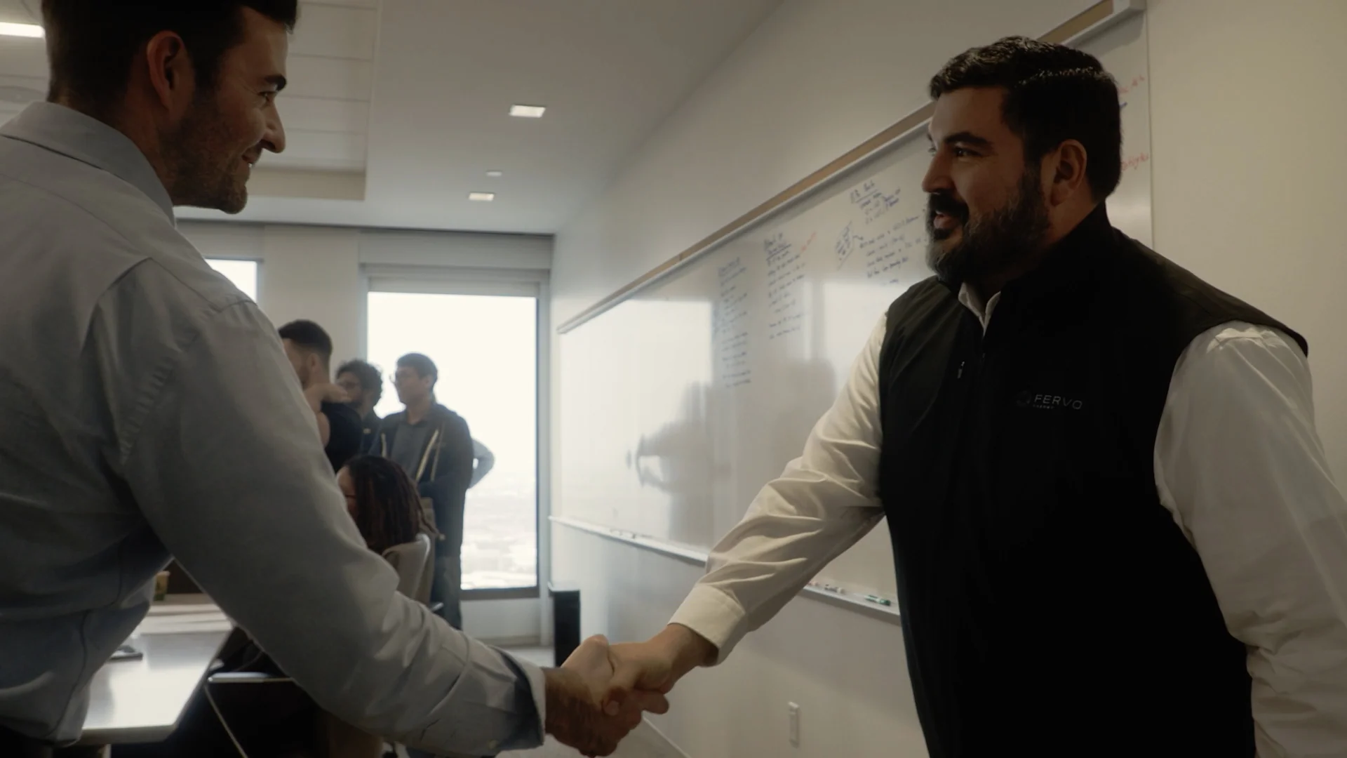 A handshake during a strategy session in Fervo's Houston office, captured by Motion Giraffx.