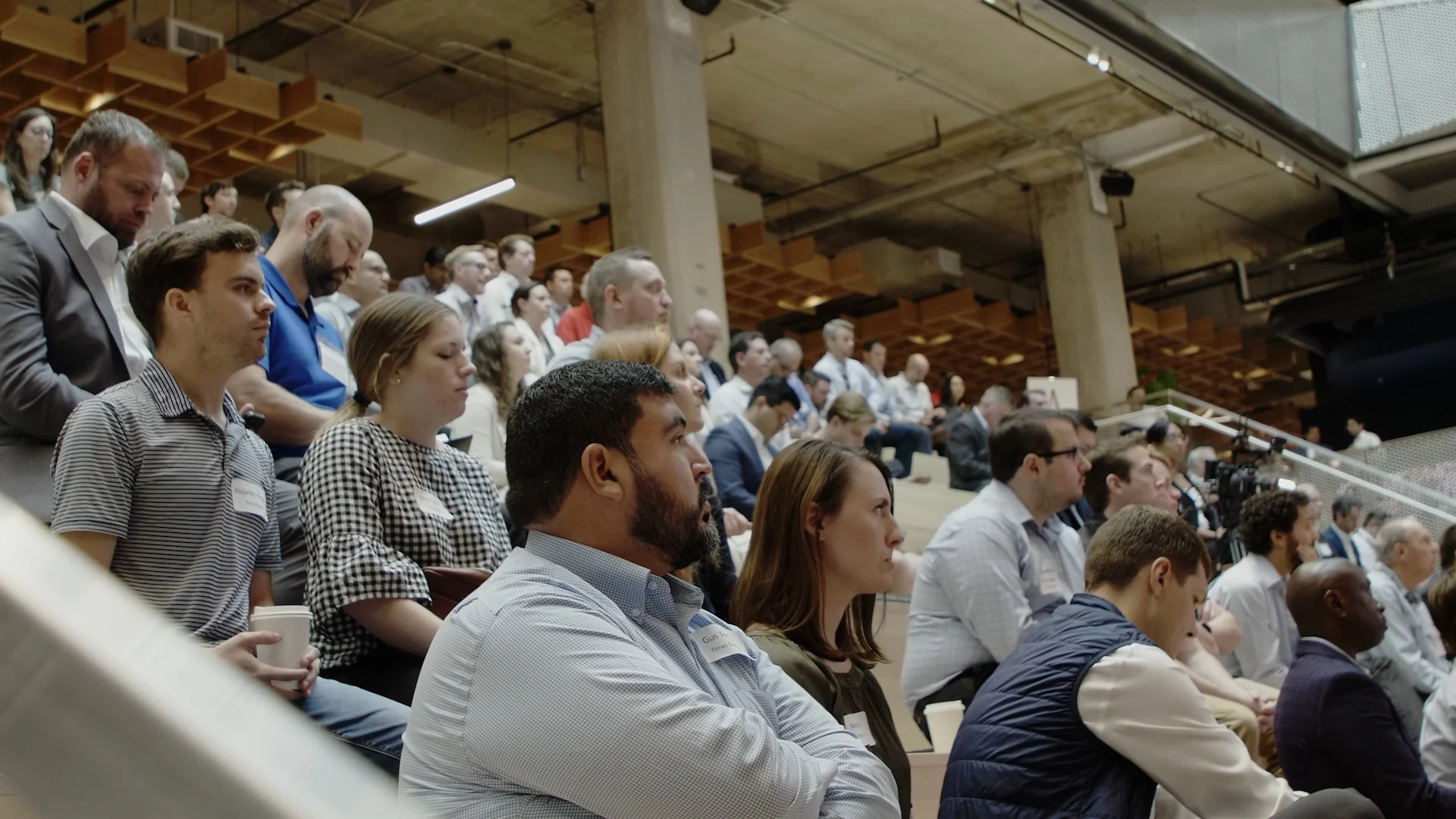 Tiered auditorium audience watching a Fervo Energy presentation, captured for the roadshow film by Motion Giraffx.